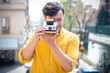 © Eugenio Marongiu - hipster young man with polaroid