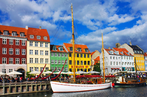 Nyhavn is old waterfront and canal district in Copenhagen. Poster