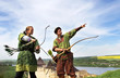 Archers with bows and arrows in medieval costumes