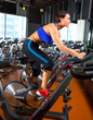 Aerobics spinning woman exercise workout at gym