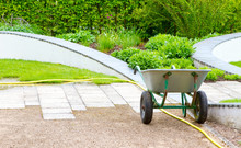 Wheelbarrow In The Garden On A Fine Spring Day
