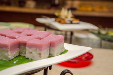 Colorful dessert on a banana leaf