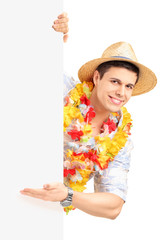 Wall Mural - Smiling man in traditional costume gesturing with his hand on a