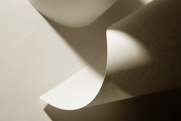 An abstract closeup photo of curve shapes made up of paper