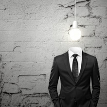 Man Without Head And With Bulb Above