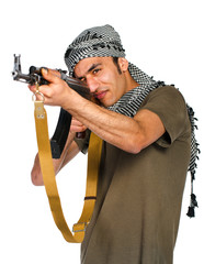 Terrorist with automatic gun on white background