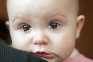 portrait of a cute little girl crying