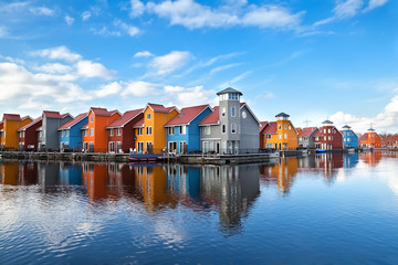 Fototapete - Reitdiephaven - colorful buildings on water