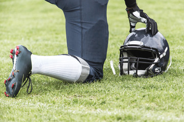 kneeling football player