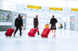 canvas print picture - Reisende am Flughafen mit Trolley