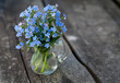 forget-me-not flowers on wooden surface