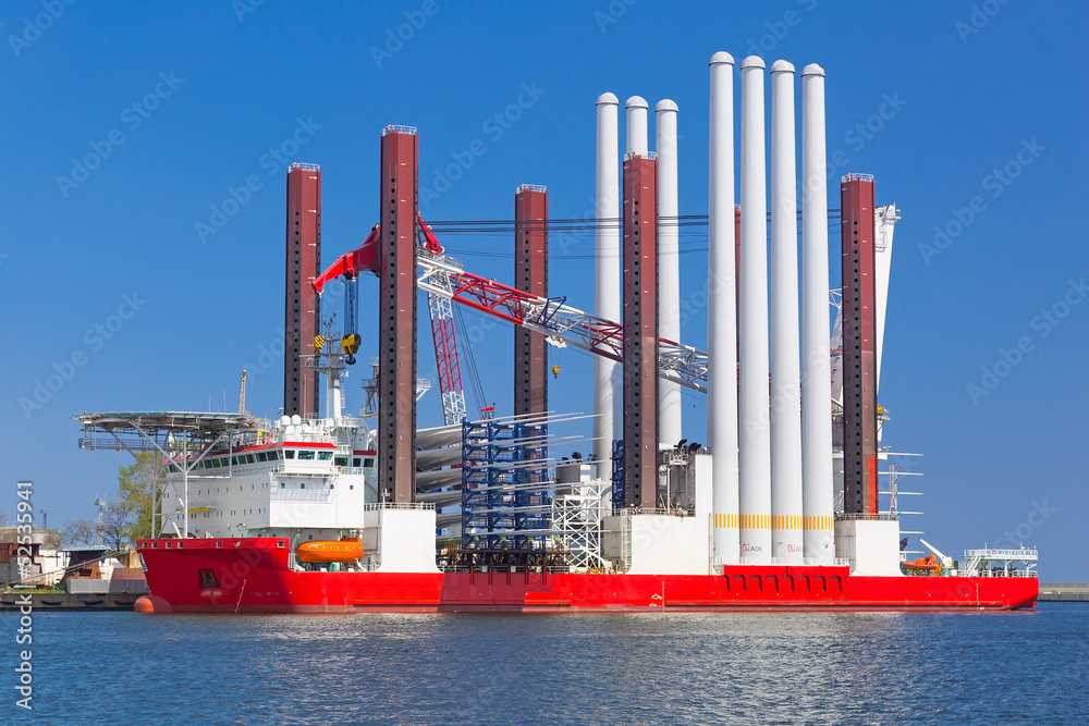 Shipyard in Gdynia with wind turbine installation vessel, Poland - obrazy, fototapety, plakaty 
