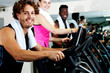 © stockyimages - People at  gym working out happily