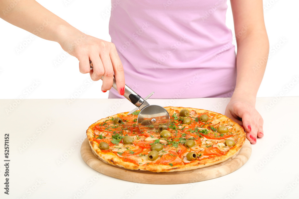 Beautiful girl cut pizza isolated on white