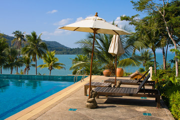 Wall Mural - Swimming pool near the sea, Thailand.