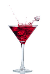 Wall Mural - Red cocktail with splash isolated on white