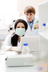 Wall Mural - Young science workers research at medical lab