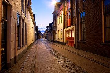 Fototapete - long street at night in Groningen, Netherlands