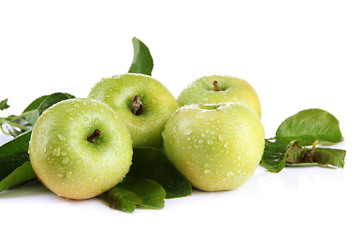 Wall Mural - Juicy green apples with leaves, isolated on white