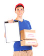 © Africa Studio - Young delivery man holding parcels and clipboard, isolated