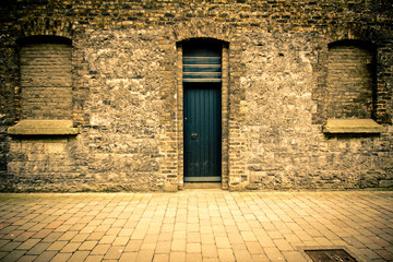 Stone building facade with door and windows