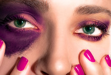Girl's Eyes And Nails. Purple And Gold Makeup