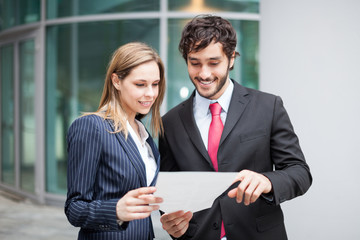 Wall Mural - Business people reading a document