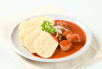 Wall Mural - Pork meat in tomato sauce with dumplings