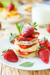 Canvas Print - curd pancake with strawberries and milk