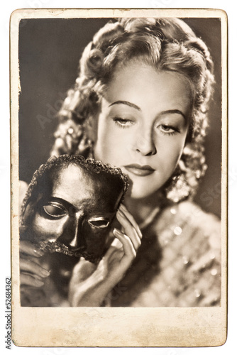 Naklejka ścienna portrait of young woman with a carnival mask