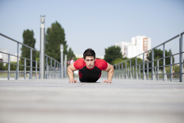 Wall Mural - Athlete making some pushup