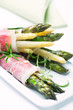 Green and white asparagus wrapped in prosciutto ham