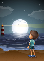 Wall Mural - A young boy watching a fullmoon at the beach