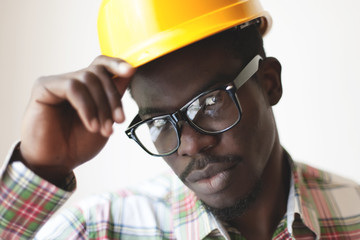 African American in a construction helmet