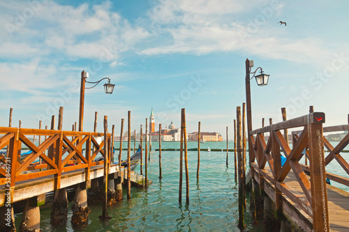 Naklejka na drzwi Pier for gondola boats at canal in Venice. Italy.