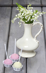 Wall Mural - Pastel cake pops in romantic spring set. Popular american desser