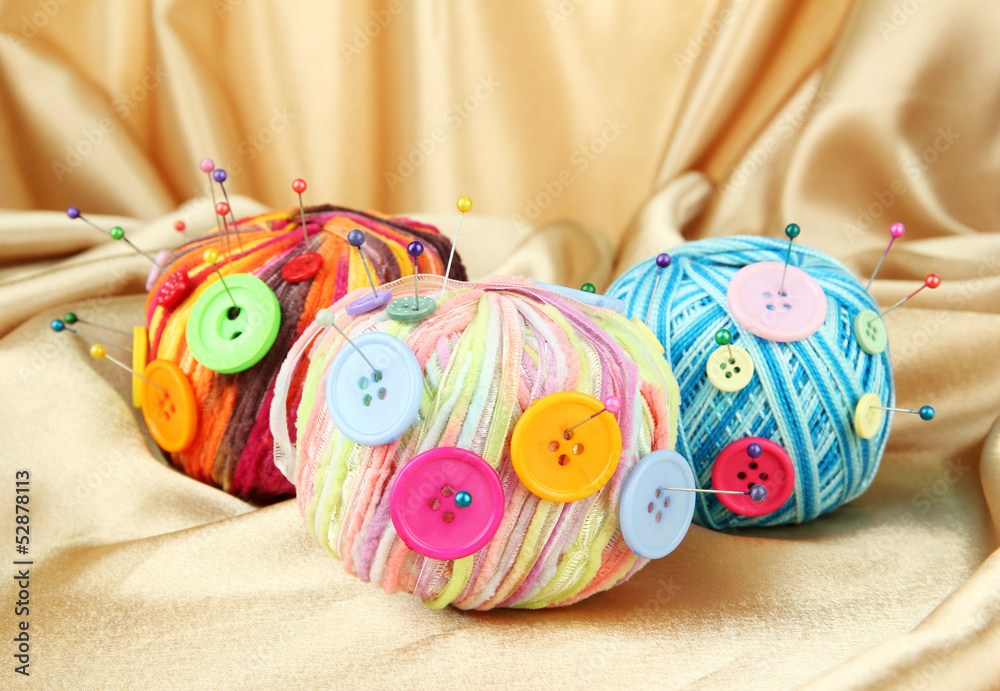 Colorful buttons and multicolor wool balls,