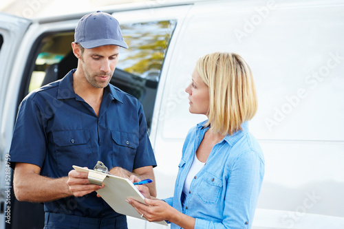 Fotografie, Obraz Customer Signing For Delivery From Courier