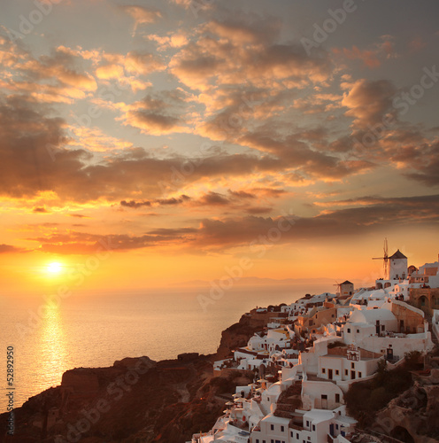 Fototapeta na wymiar Santorini with sunset over sea in Greece, Oia village