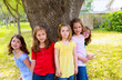 Children group friend girls playing on tree