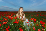 Fototapeta Kuchnia - girl in a white dress in the poppy field