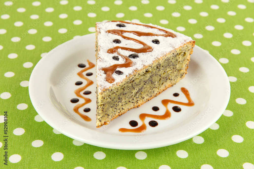 Delicious poppy seed cake on table close-up