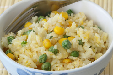 Fried rice with egg, green peas and sweetcorn