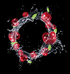 Wall Mural - Fresh fruit in water splash, isolated on black background