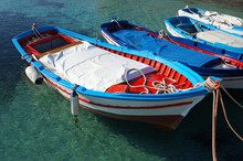 Wooden Fishing Boats On Crystalline Water
