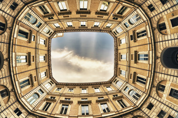 Wall Mural - Square between the buildings with beautifull sky.