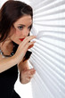 © auremar - Woman peering through venetian blinds