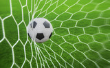 Fototapeta Młodzieżowe - soccer ball in goal