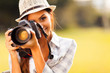 attractive young woman taking pictures