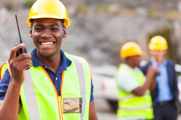 afro american mine worker with walkie talkie